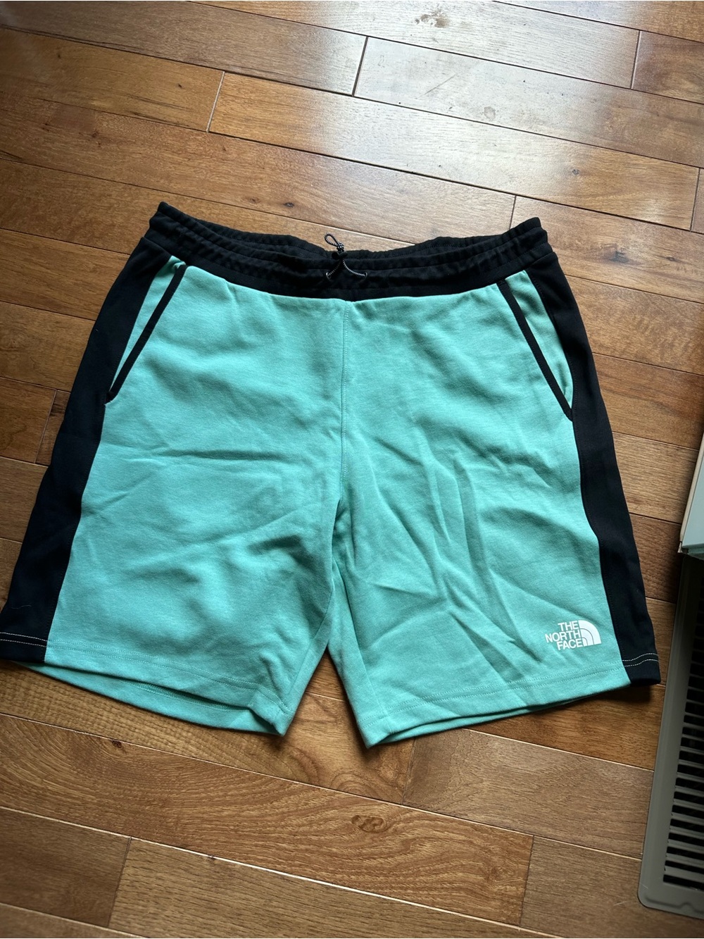 The North Face Men's Mint Green Athletic Shorts with Black Panels